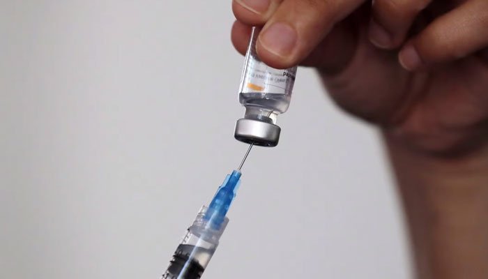 Bild einer Nadel und eines Fläschchens mit Impfstoff.  — AFP/Dossier