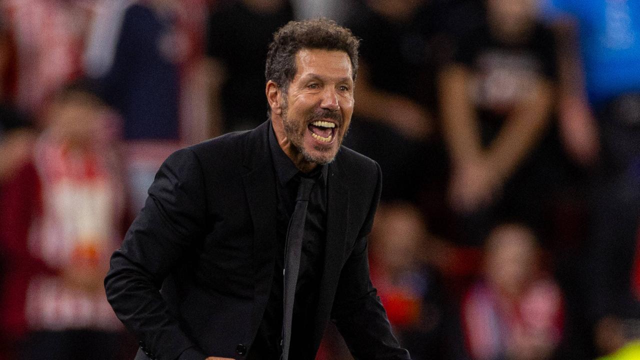 Atletico -Trainer von Simon von Simmone mit einem Fan von zusammen