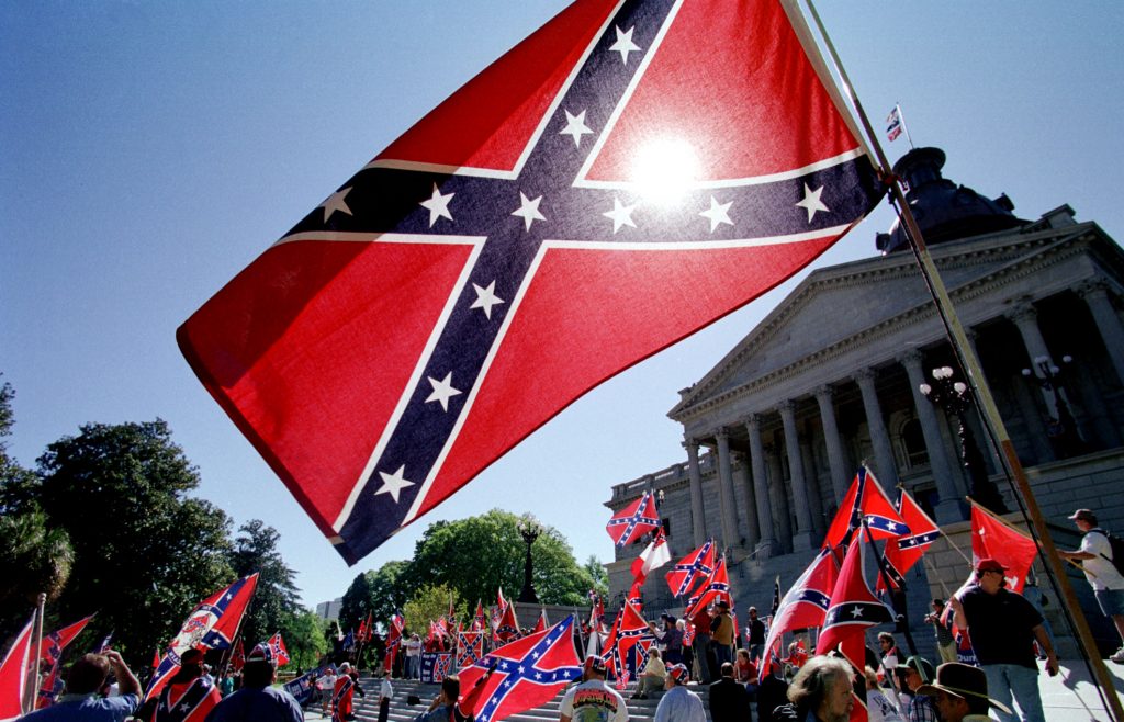 Confederate flag supporters demonstrate on the nor
