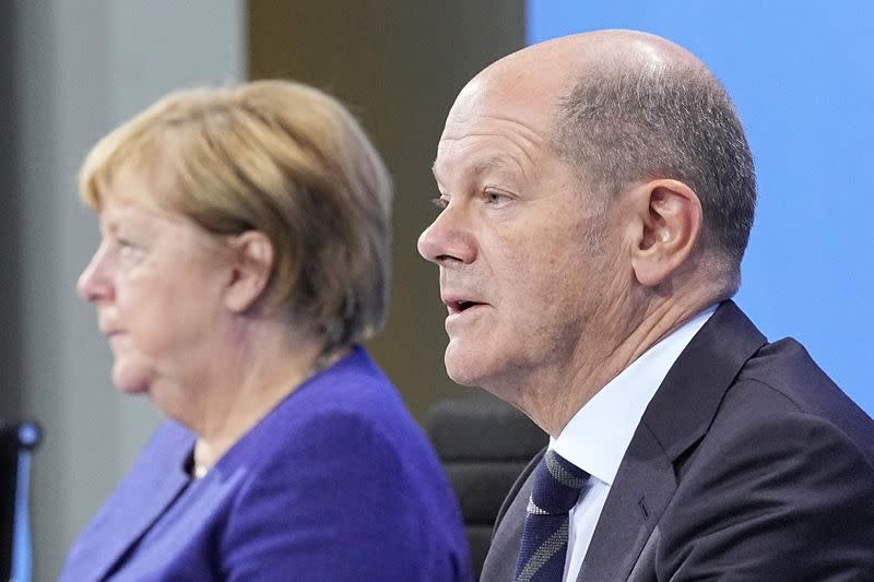 Die Deutschen Merkel und Scholz rufen COVID-19-Treffen mit Staatschefs ein