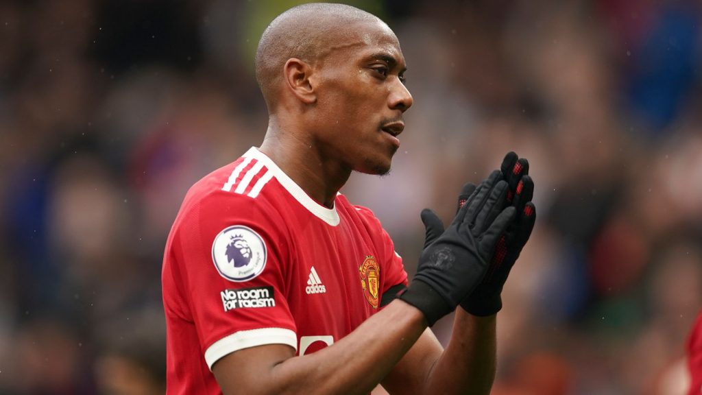 Manchester United...s Anthony Martial applauds fan as he walks off the pitch at half-time, during the English Premier League soccer match between Manchester United and Everton, at Old Trafford, Manchester, England, Saturday, Oct. 2, 2021. (Dave Thompson, Pool via AP)