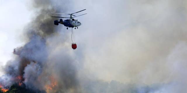 Waldbrände wüten, während Teile Spaniens mit einer Rekordhitzewelle kämpfen. 