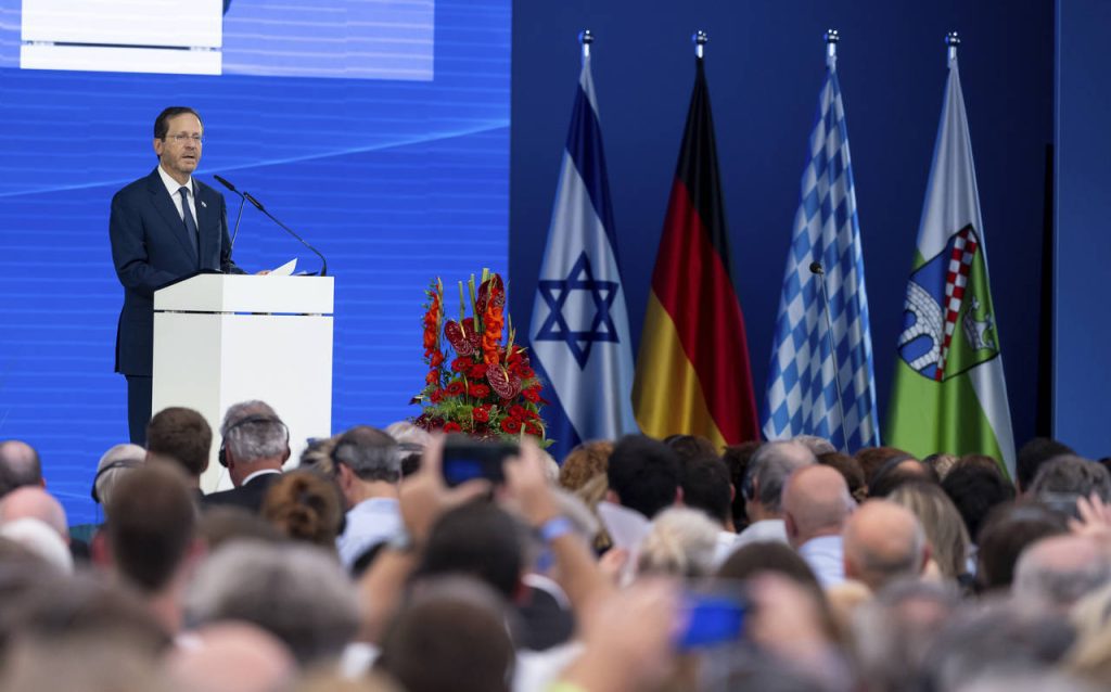 Israeli President Isaac Herzog delivers his speech during a ceremony to commemorate the victims of ...