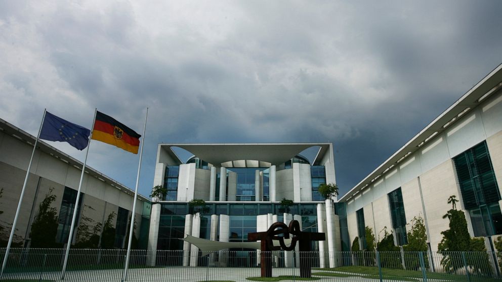 FILE - Dark clowds covert sky over the frontside of the German Chancellery in Berlin, May 26, 2009. The costs for the planned extension of Germany's Chancellery will rise to 777 million euros, 773 million Dollars, which 177 million euros more than in